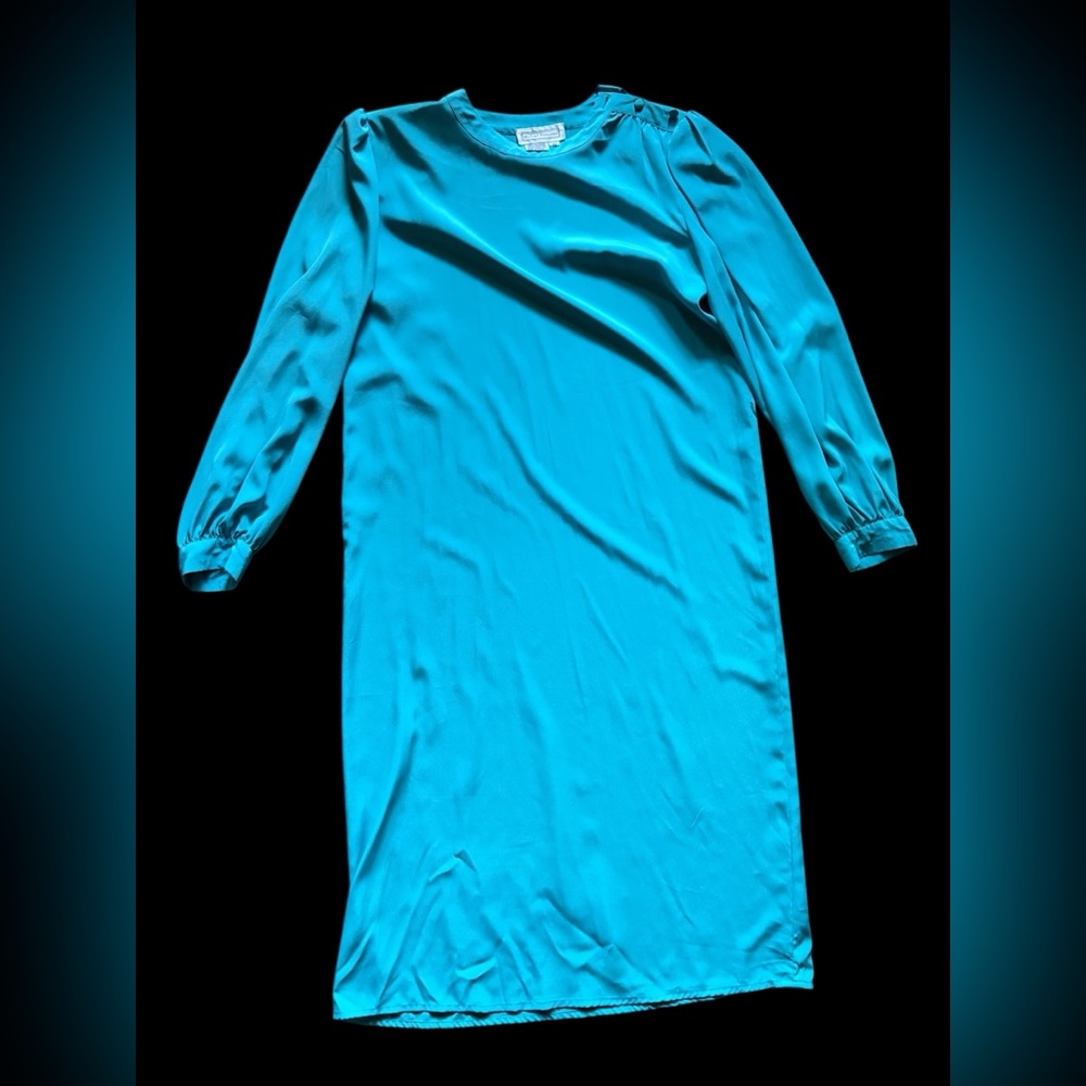 Tammy Faye Would Have Loved This Vibrant Teal Dress